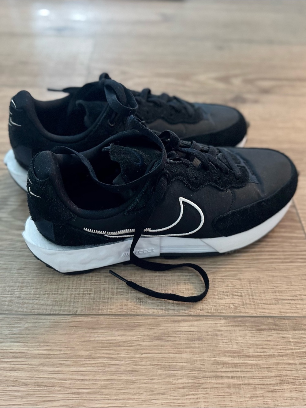 Nike Black Sneakers with White Swoosh Accents